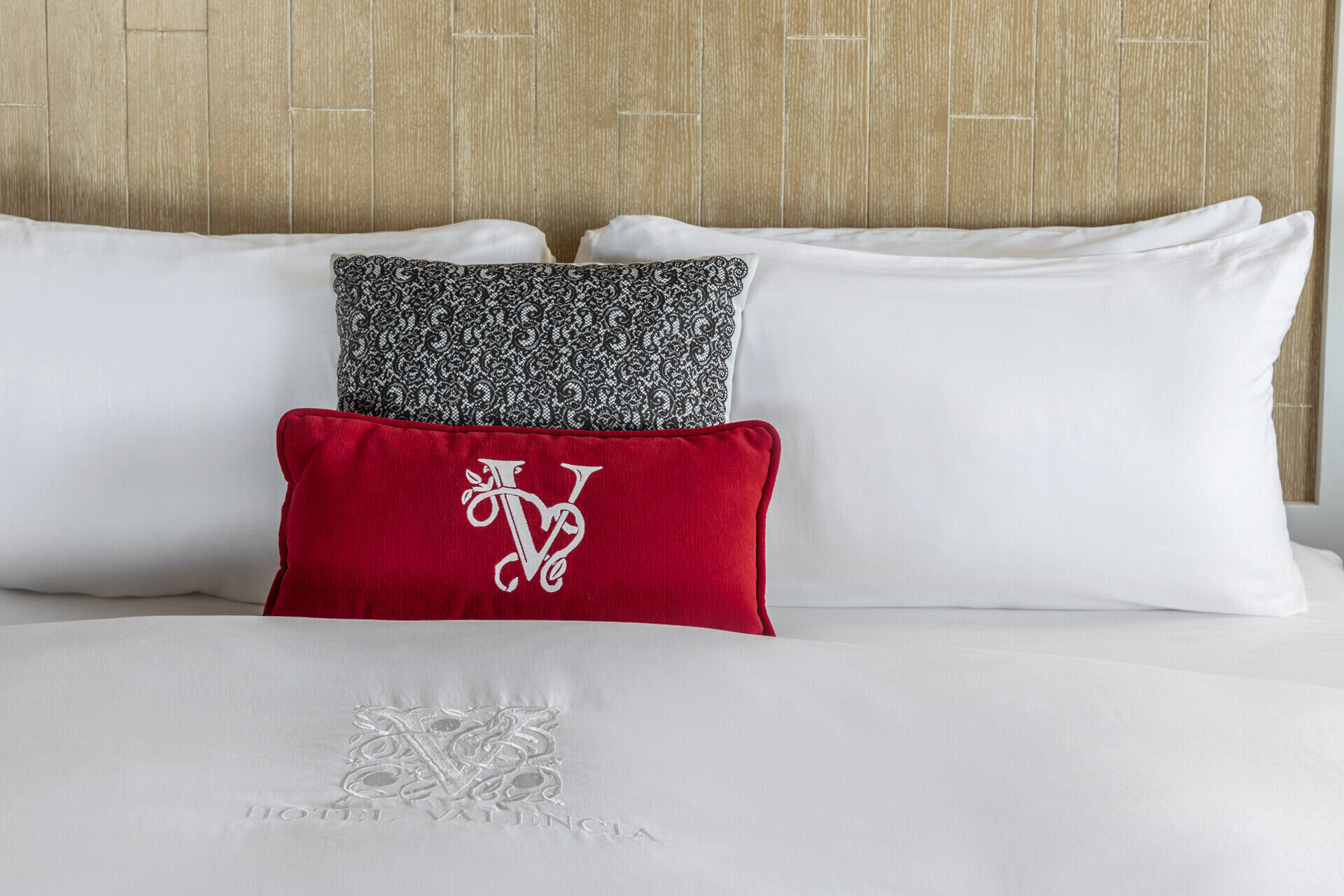 Bed with red pillow
